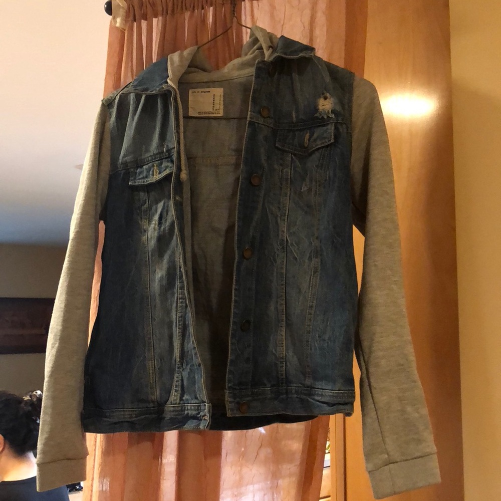 Hooded denim jacket with sweatshirt built in.